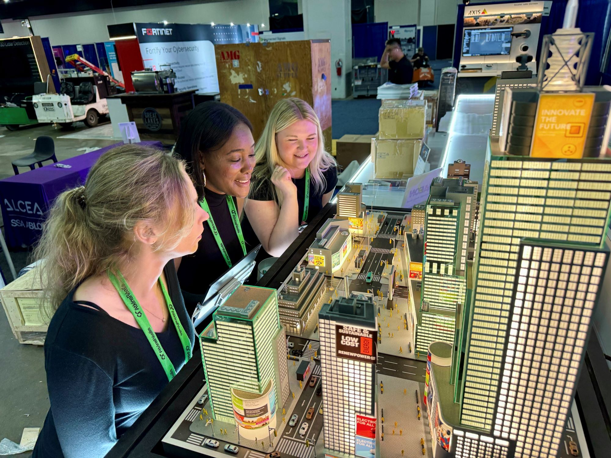 Figure 3 Visitors explore LEOTEK’s smart city demonstration at ITS America 2026_