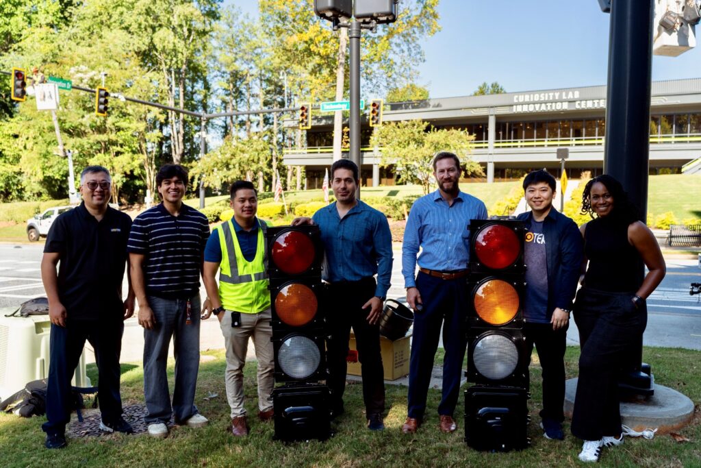 LEOTEK Intelligent Transportation Product Manager Eric Zhao (far left); Curiosity Lab Innovation Program Manager Pouyan Azizpour (fourth from left); Peachtree Corners Deputy City Manager Seth Yurman (third from right); LEOTEK Intelligent Transportation AI Solution Architect David Tzou (second from right); and Curiosity Lab Community & Operations Manager Kim Littrean (far right).